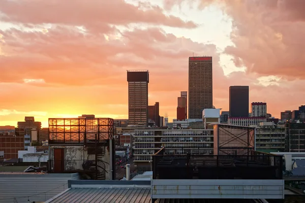 Johannesburg inner-city skyline at dawn, representing a South African Urban Development Zone