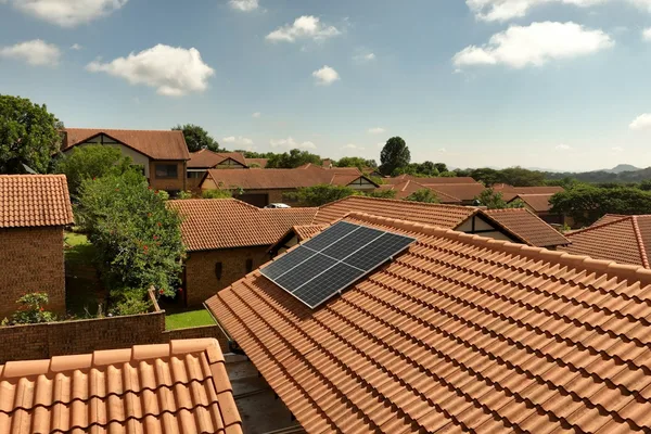 Rooftop solar panel installation on a South African suburban home
