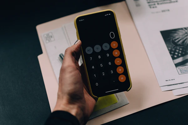 Calculator and financial documents — transfer costs and bond registration guide SA 2026